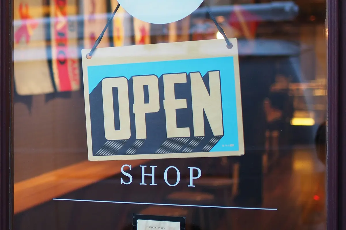 Local business storefront with an Open sign